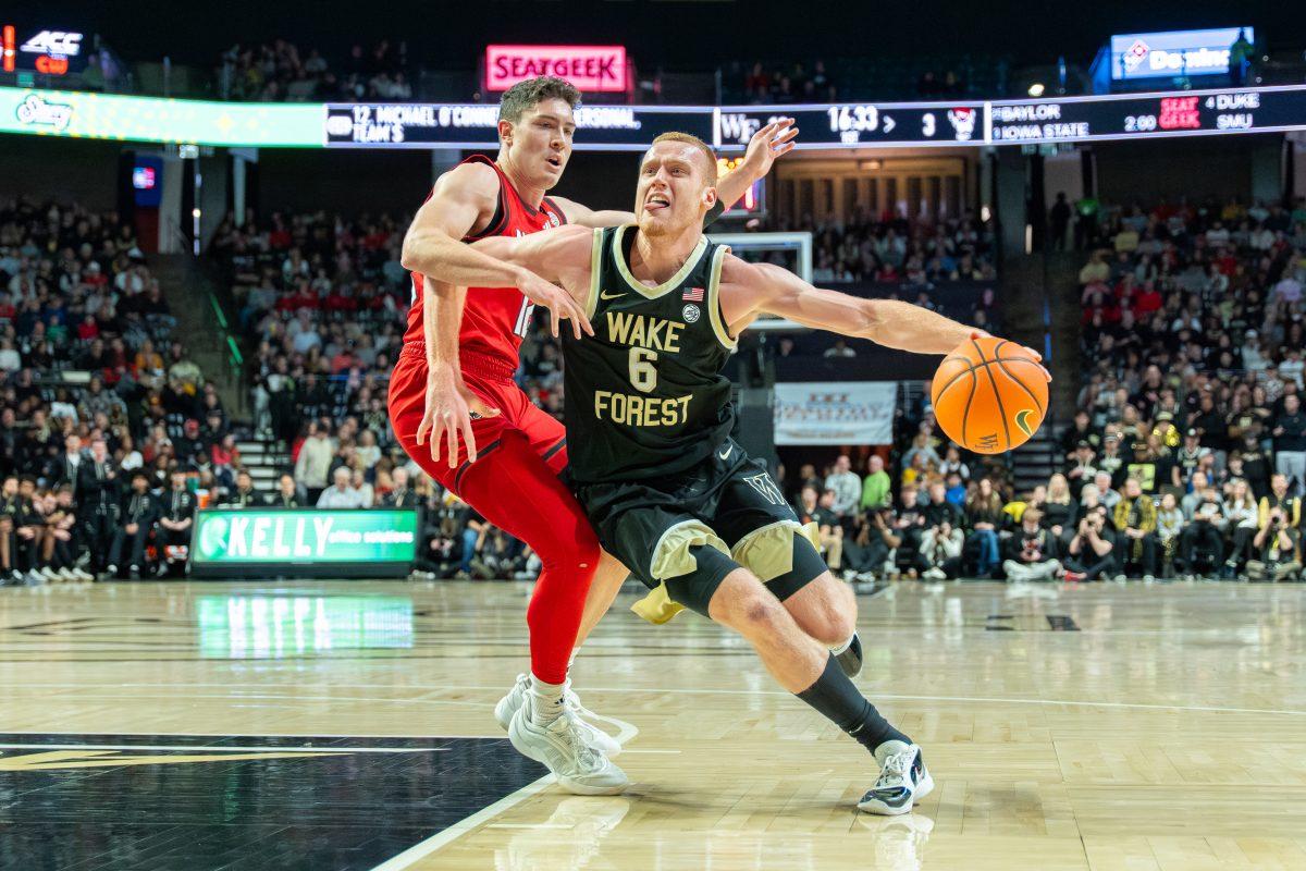 Graduate guard Michael O'Connell defends an opponent during the game against Wake Forest University in the LJVM Coliseum on Saturday, Jan. 4, 2025. O'Connell scored 10 points and made four rebounds. NC State lost the game 59-77.