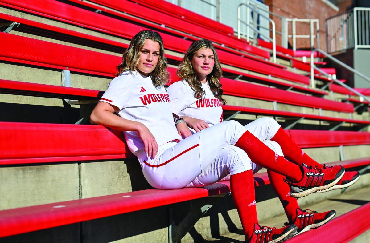 Sophomore outfielder Tori Ensley (left), and senior infielder Taylor Ensley (right) pose for a photo in Dail Softball Stadium on Friday, Jan. 17, 2025. The sisters on the NC State softball team have made a name for themselves, finishing in the top five in batting average last season.