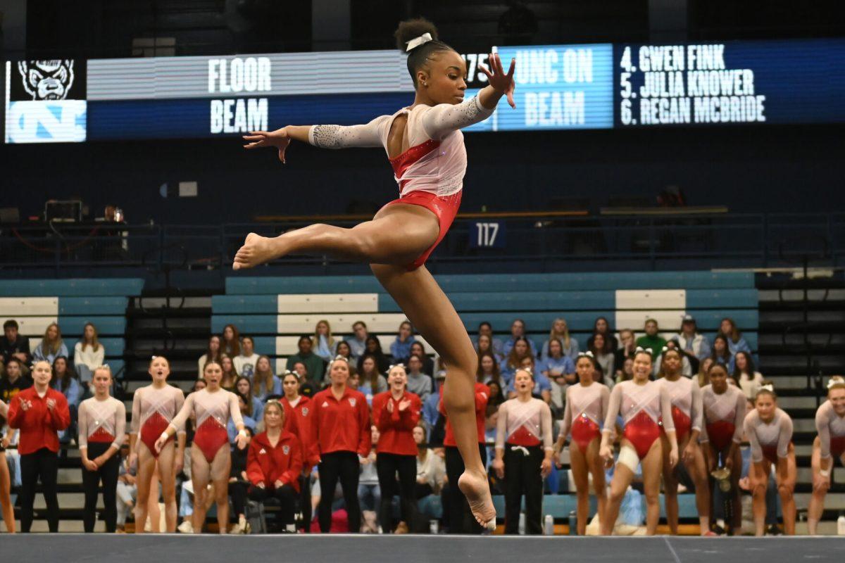 Sophomore Ashley Knight leaps in the air while performing at the meet against UNC-Chapel Hill at Carmichael Arena on Friday, Jan. 24, 2025. Knight scored a 9.850 average on her floor routine. NC State beat UNC 196.350-195.925.