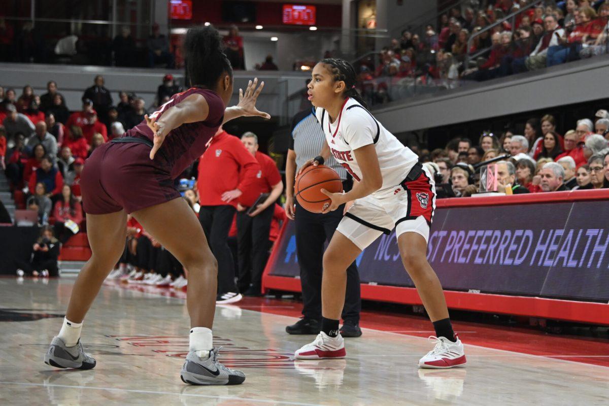 Freshman guard Zamareya Jones defends the ball during the match against Virginia Tech in Reynolds Coliseum on Sunday, Jan. 26, 2025. Jones had three rebounds and scored seven points. The Wolfpack beat the Hokies 85-57.