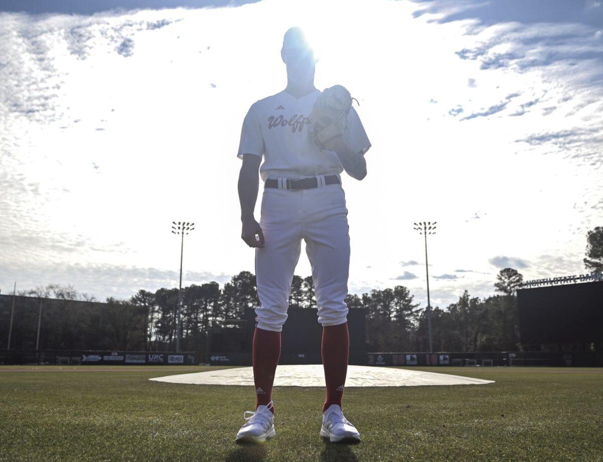 Sophomore pitcher Jacob Dudan stands in front of the pitcher&#8217;s mound at Doak Field at Dail Park on Friday, Jan. 24, 2025. In 2024, Dudan made 27 appearances on the mound, the most of any pitcher on the team.
