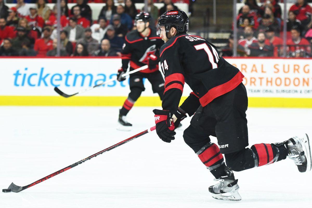 Defenseman Jaccob Slavin passes the puck during the Carolina Hurricanes game versus the Washington Capitals at PNC Arena on Friday, April 5, 2024. The Hurricanes beat the Capitals 4-2.