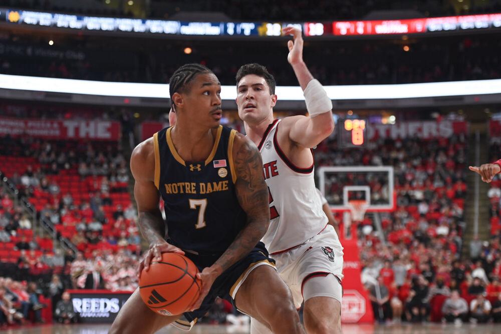 Graduate guard Michael O'Connell defends an opponent during the match against Notre Dame at the Lenovo Center on Wednesday, Jan. 8, 2025. O'Connell scored five points and had two rebounds. NC State beat Notre Dame 66-65.