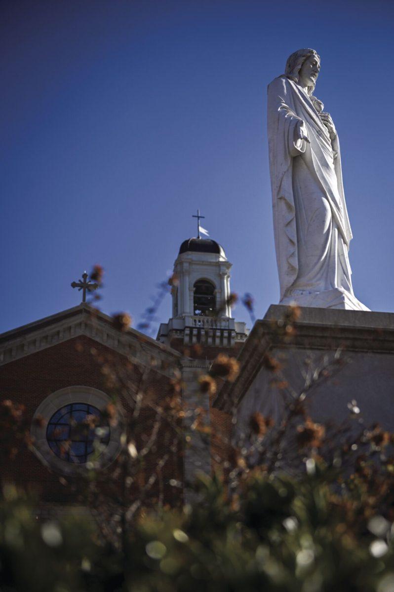 A statue of Jesus Christ stands in front of the Holy Name of Jesus Cathedral in Raleigh, NC on Monday, Jan. 20, 2025. Formerly known as Sacred Heart Cathedral, which offers Spanish and English Mass.