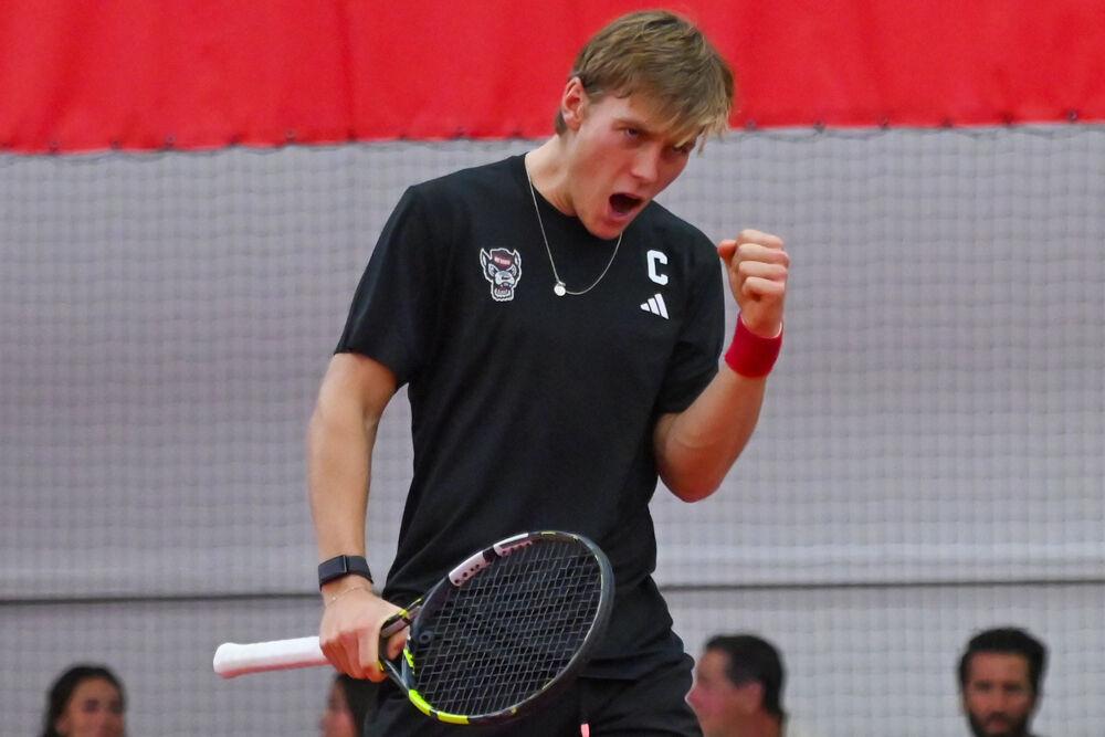 Senior Fons Van Sambeek yells after scoring in his singles game against NC Central at the J.W. Isenhour Tennis Center on Saturday, Jan. 18, 2025. Van Sambeek won his singles match 2-0, with scores of 6-2 and 6-4 for the individual sets. NC State won the match 7-0.