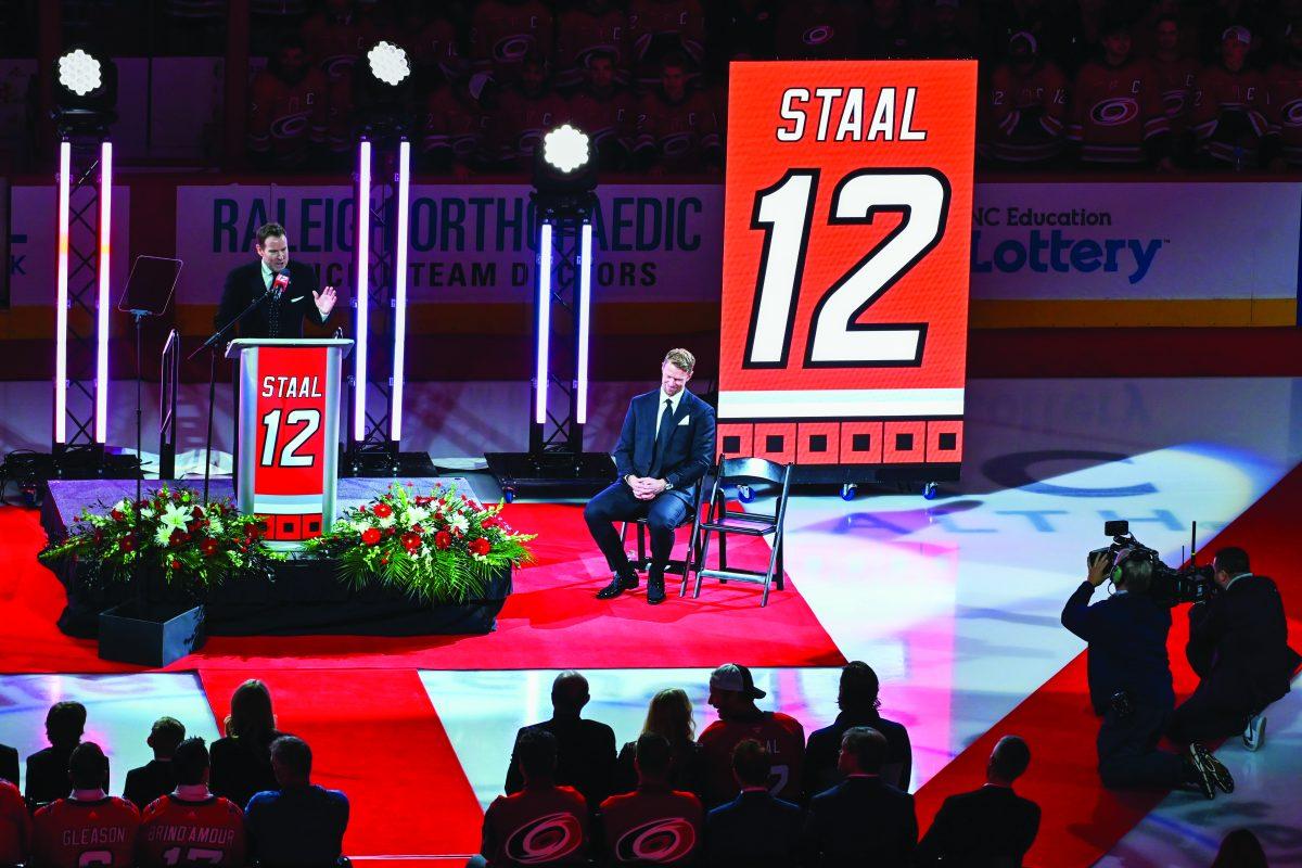 Former Hurricanes team captain Eric Staal sits next to the stage during the Eric Staal retirement ceremony at Lenovo Center on Sunday, Jan 12, 2025. Staal was inducted into the Hurricanes Hall of Fame and his jersey, #12, was raised into the rafters.