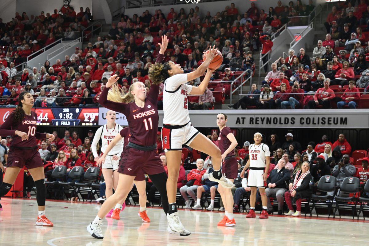 Graduate guard Madison Hayes shoots the ball during the match against Virginia Tech in Reynolds Coliseum on Sunday, Jan. 26, 2025. Hayes had six rebounds and scored 12 points. The Wolfpack beat the Hokies