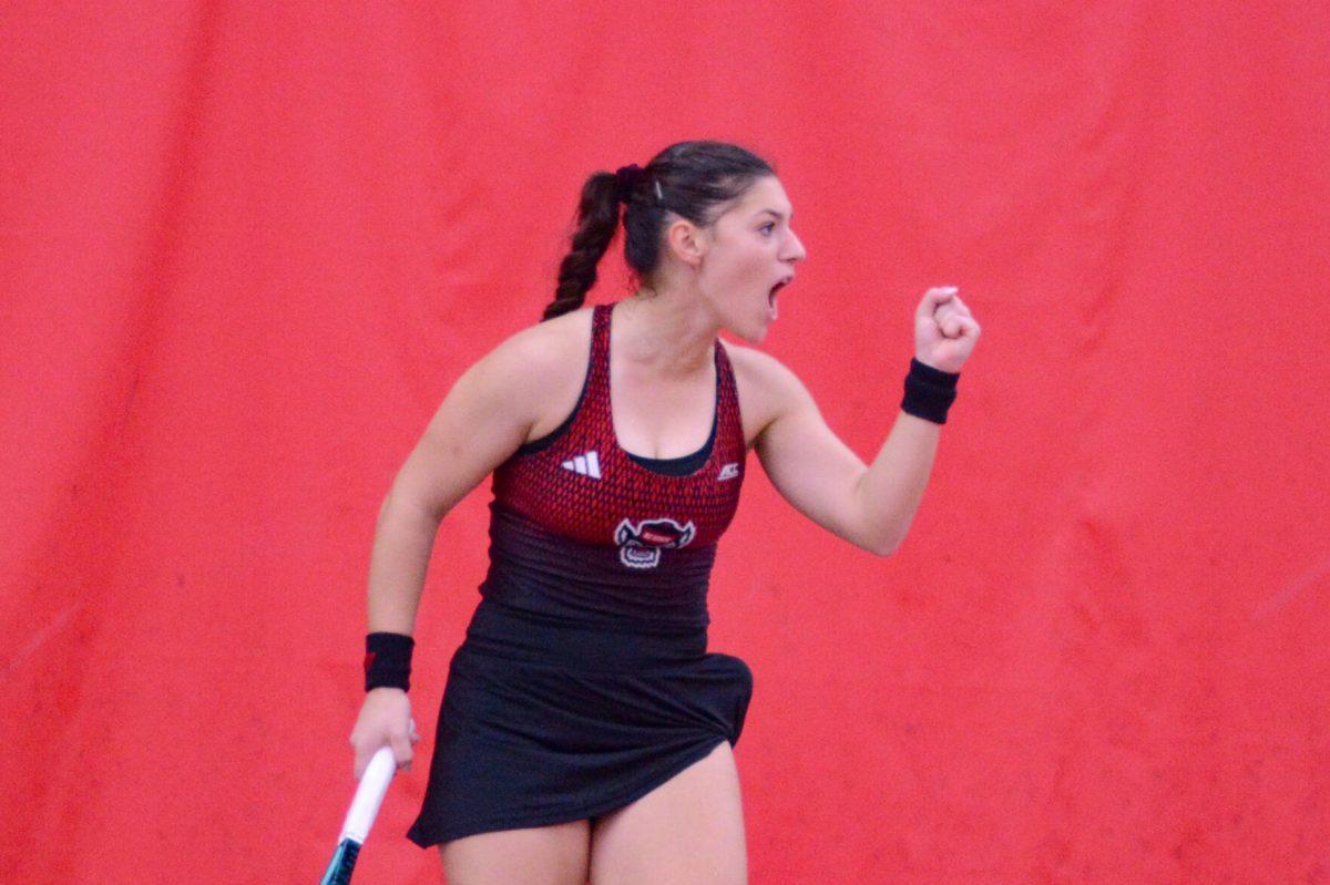 Freshman Michaela Laki celebrates winning a set during the tennis match against Pepperdine at the J.W. Isenhour Tennis Center on Sunday, Jan. 19, 2025. Laki won her singles match 2-0. NC State defeated Pepperdine 5-2.