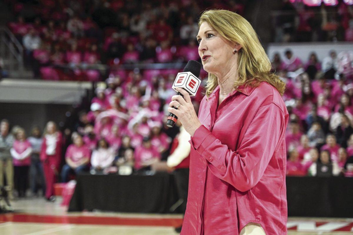 Debbie Antonelli, NC State women's basketball guard from 1982-86 and color commentator for ESPN, introduces the halftime recognition of women who have survived breast cancer and their stories during halftime in the game against Louisville in Reynolds Coliseum on Monday, Feb. 5, 2024. NC State beat Louisville 77-67.
