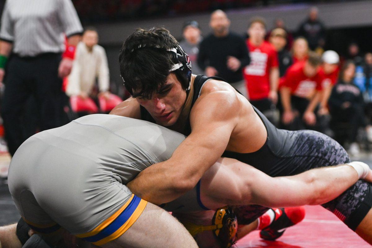 Redshirt sophomore Matty Singleton keeps his opponent on lock in the match against Pitt in Reynolds Coliseum on Friday, Jan. 24, 2025. Singleton lost the 174 bout 3-1. NC State beat Pitt 22-13.