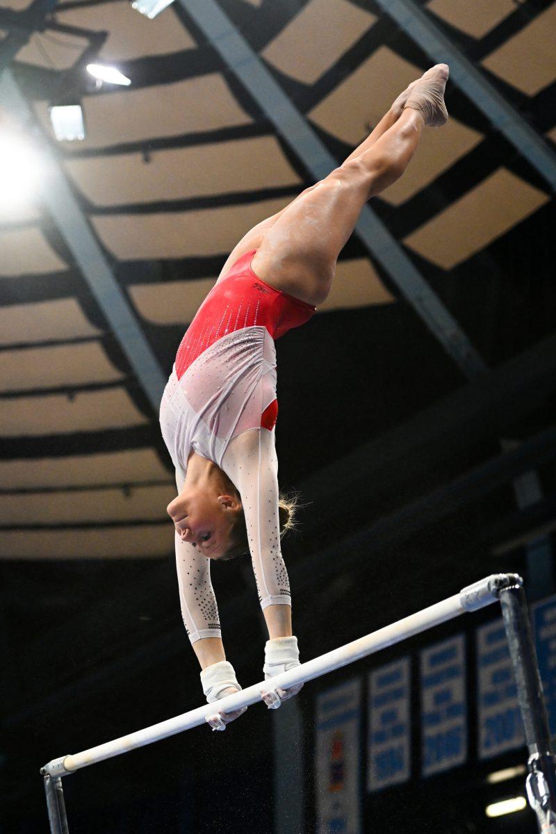 Freshman Caroline Volk rotates on the uneven bars during the meet against UNC-Chapel Hill in Carmichael Arena on Friday, Jan. 24, 2025. Volk earned a 9.750 on the uneven bars. The Wolfpack beat the Tar Heels 196.350-195.925.