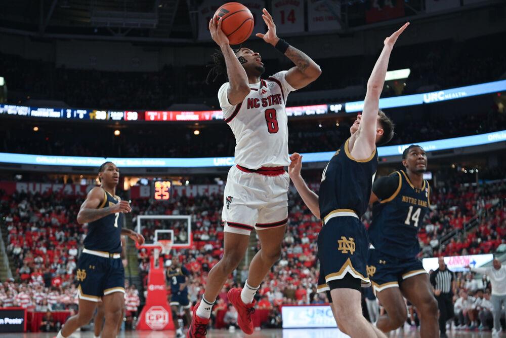 Senior guard Jayden Taylor shoots the ball during the match against Notre Dame in the Lenovo Center on Wednesday, Jan. 8, 2025. Taylor scored 14 points and had two rebounds. NC State beat Notre Dame 66-65.