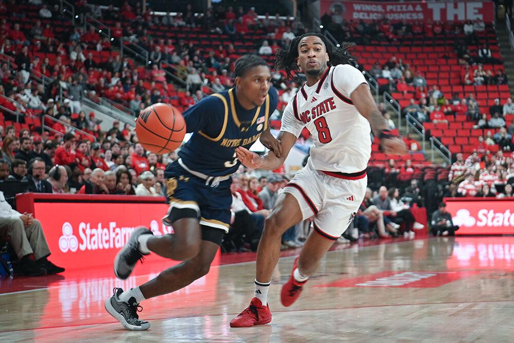 Senior guard Jayden Taylor defends an opponent during the match against Notre Dame in the Lenovo Center on Wednesday, Jan. 8, 2025. Taylor scored 14 points and had two rebounds. NC State beat Notre Dame 66-65.