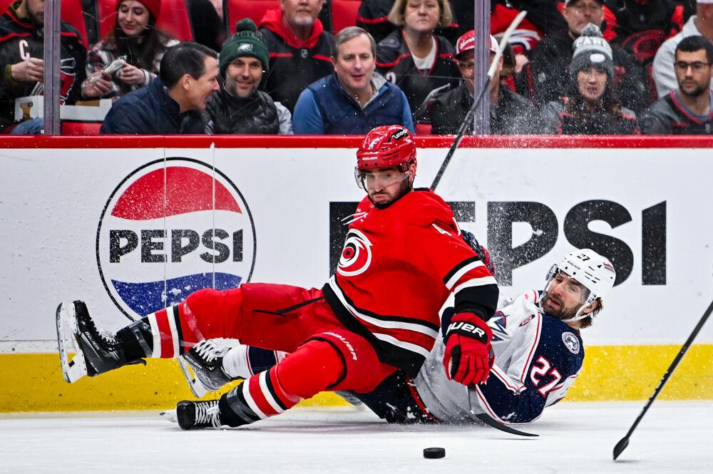 Defenseman Shayne Gostisbehere collides with Blue Jackets forward Zachary Aston-Reese during the game in the Lenovo Center on Thursday, Jan. 23, 2025. Carolina defeated Columbus 7-4.
