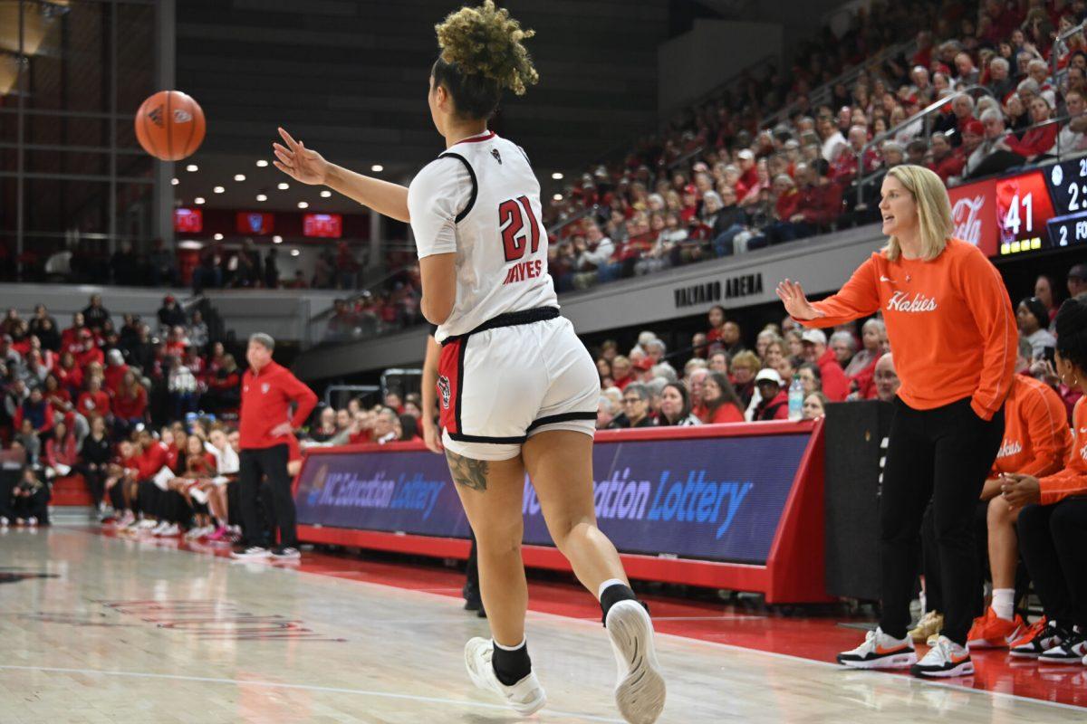 Graduate guard Madison Hayes passes the ball during the match against Virginia Tech in Reynolds Coliseum on Sunday, Jan. 26, 2025. Hayes had six rebounds and scored 12 points. The Wolfpack beat the Hokies