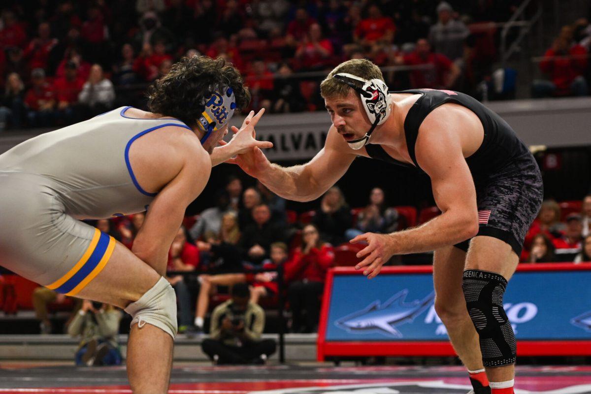 Redshirt sophomore Dylan Fishback tussles with his opponent during the match against Pitt in Reynolds Coliseum on Friday, Jan. 24, 2025. Fishback lost the 184 bout 6-2. NC State beat Pitt 22-13.