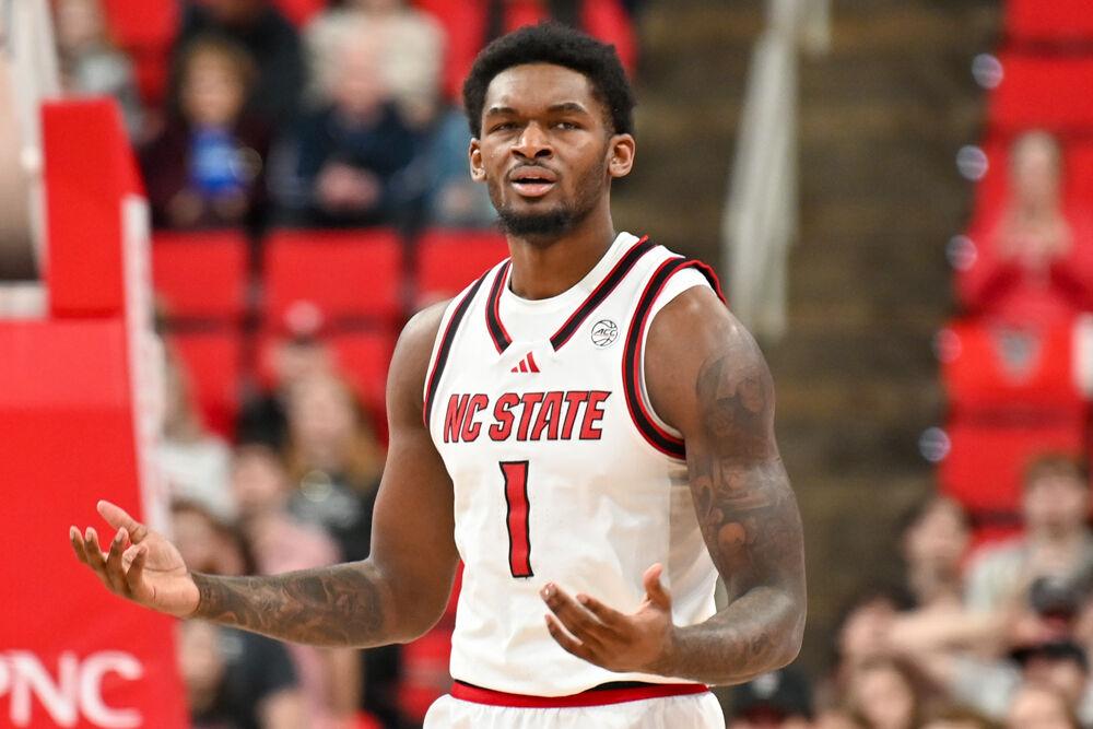 Senior forward Brandon Huntley-Hatfield holds his hands up during the game against SMU in the Lenovo Center on Saturday, Jan. 25, 2025. The Wolfpack lost to the Mustangs 63-57.