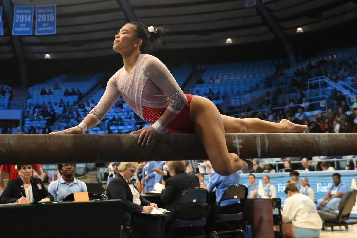 Sophomore Maddie Hall performs on the balance beam during the match against UNC-Chapel Hill at Carmichael Arena on Friday, Jan. 24, 2025. Hall scored a 9.725 average on the balance beam. NC State beat UNC 196.350-195.25.
