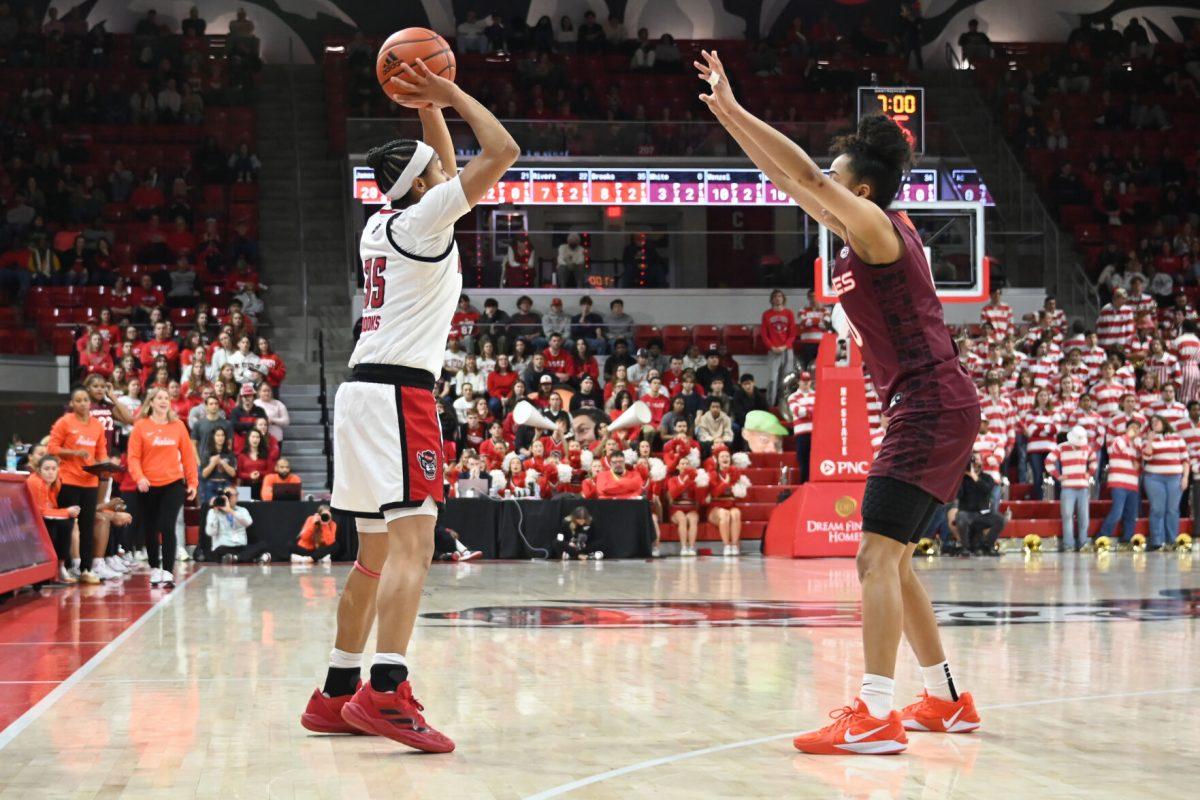 Sophomore guard Zoe Brooks prepares to pass the ball during the match against Virginia Tech in Reynolds Coliseum on Sunday, Jan. 26, 2025. Brooks has eight rebounds and scored 12 points. The Wolfpack beat the Hokies 85-57.