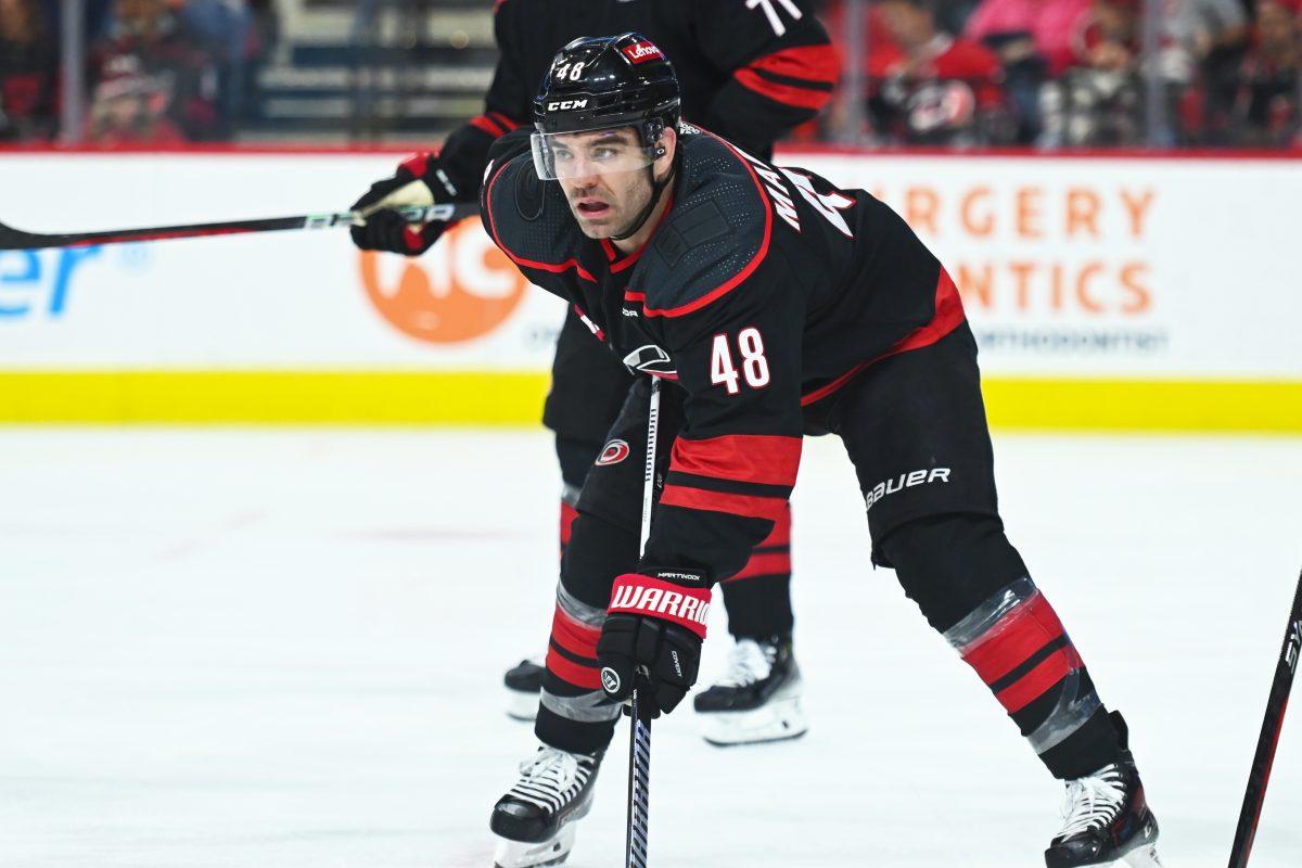 Left wing Jordan Martinook waits for the puck to drop during the Carolina Hurricanes game versus the Washington Capitals at PNC Arena on Friday, April 5, 2024. The Hurricanes beat the Capitals 4-2.