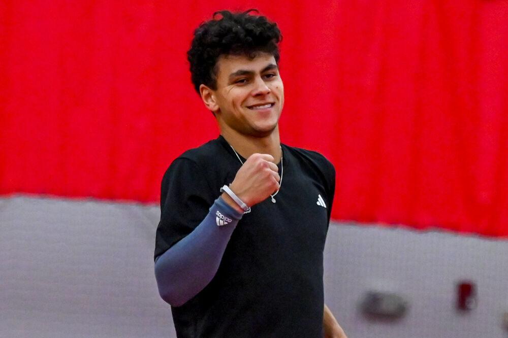 Freshman Noah Gabriel smiles after scoring in a doubles game against NC Central at the J.W. Isenhour Tennis Center on Saturday, Jan. 18, 2025. Gabriel won his singles match 6-0. NC State won the match 7-0.