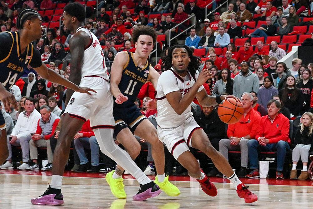 Senior guard Jayden Taylor moves past an opponent during the game against Notre Dame in the Lenovo Center on Wednesday, Jan. 8, 2025. Taylor scored 14 points for the Wolfpack, on top of making two steals. NC State won the game 66-65.