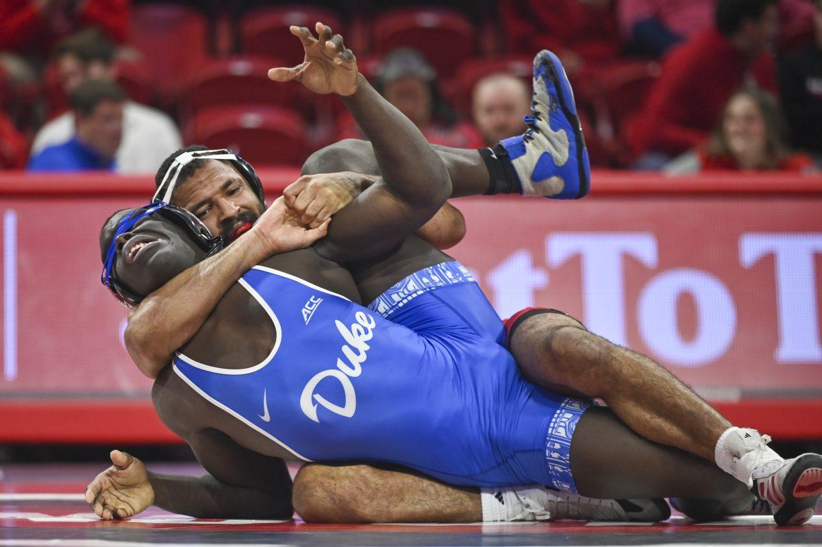 Redshirt senior Christian Knop restrains his opponent during the wrestling match against Duke in Reynolds Coliseum on Friday, Jan. 10, 2025. Knop won the 197 bout by technical fall 20-4. NC State beat Duke 47-0.