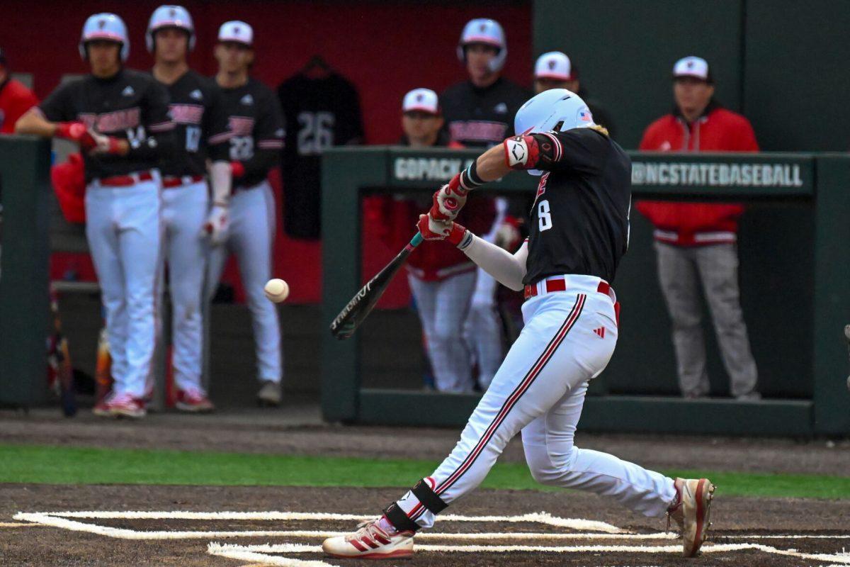 Senior Infielder Justin DeCrisco swings at the ball during the game against Fordham on Feb. 15, 2025 at Doak Field at Dail Park. DeCrisco scored one run and got one hit. The Wolfpack defeated the Rams 19-6.