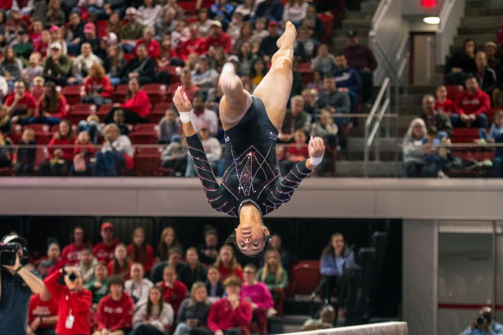 Junior Meg Adler flips on the beam during the meet against California in Reynolds Coliseum on Sunday, Feb. 2, 2025. Adler scored 9.800 points on the balance beam. The Wolfpack lost to the Bears 197.175-196.550