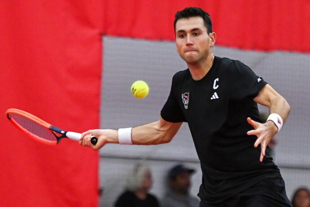 Senior Luca Staeheli prepares to return the ball in his singles game against NC Central at the J.W. Isenhour Tennis Center&#160;on Saturday, Jan. 18, 2025. Staeheli won his singles match 2-0, with scores of 6-2 and 6-3 for the individual sets. NC State won the match 7-0.