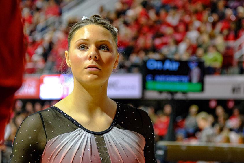Freshman Caroline Volk looks out to the crowd during the meet against UNC-Chapel Hill&#160;at Reynolds Coliseum on Friday, Feb. 21, 2025. Volk scored a 9.85 on the uneven bars. NC State beat UNC 197.025-195.500.