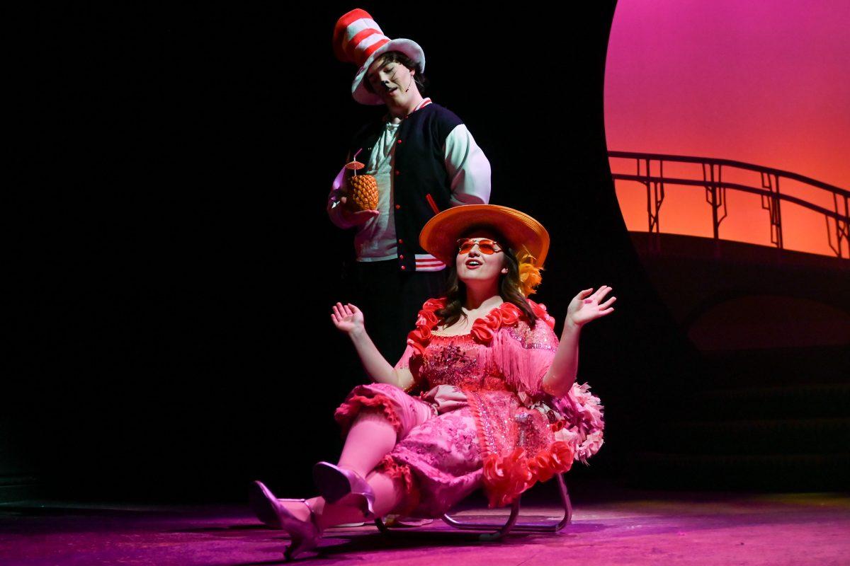Owen Durso, a first-year studying nuclear engineering, playing the Cat in the Hat looks down at Brinley Carter, a third-year studying communication, who plays Mayzie during a performance of "Seussical" in Stewart Theater on Tuesday, Feb. 18, 2025. "Seussical" is runs from Feb. 20-23. The performance is based on various works by Dr. Seuss and is directed by Mia Self, assistant director of acting and directing at University Theater.
