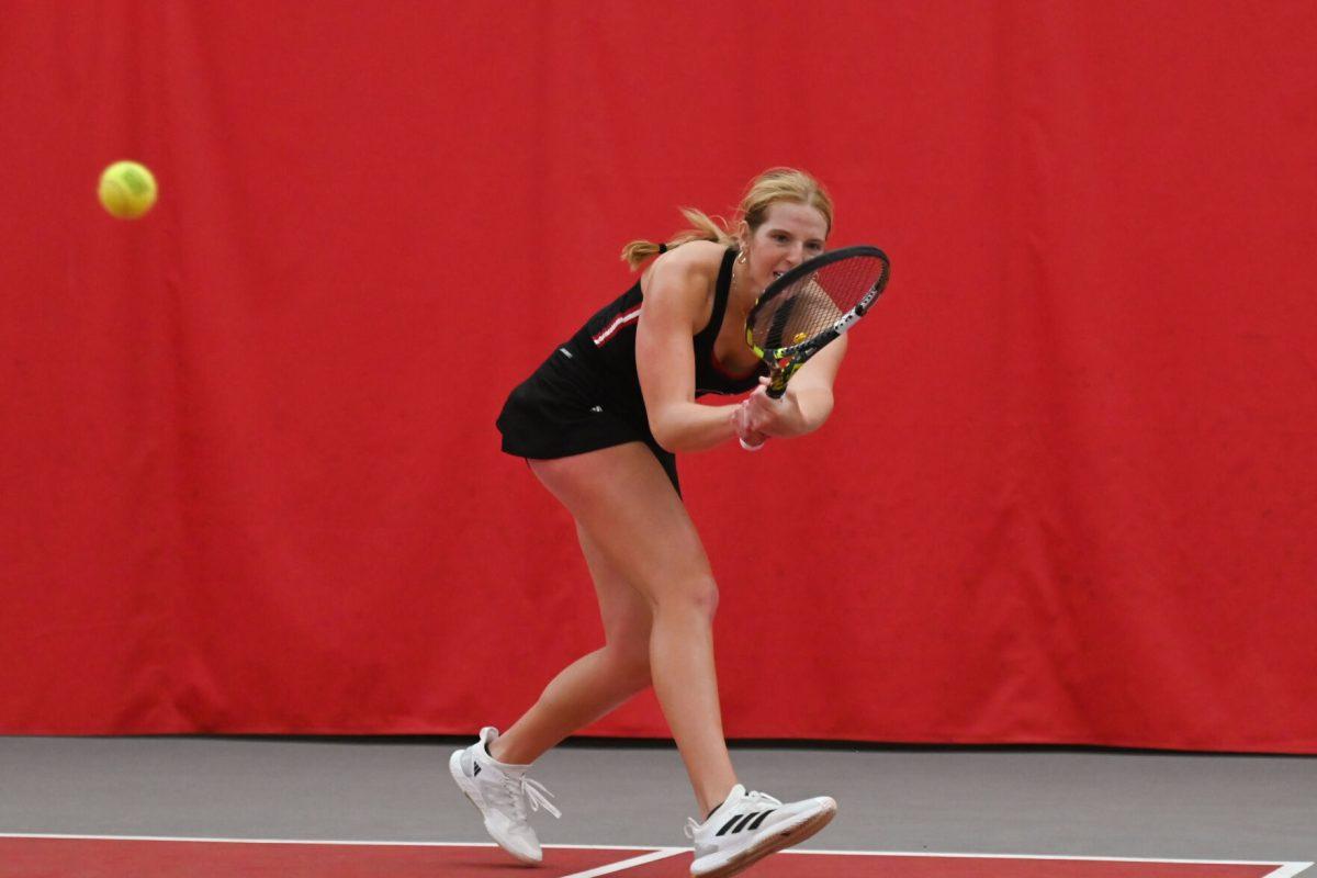 Sophomore Maddy Zampardo lunges towards the ball during the match against Michigan at J. W. Isenhour Tennis Center on Friday, Feb. 14, 2025. Zampardo won her singles match 2-0. NC State beat Michigan 5-2.