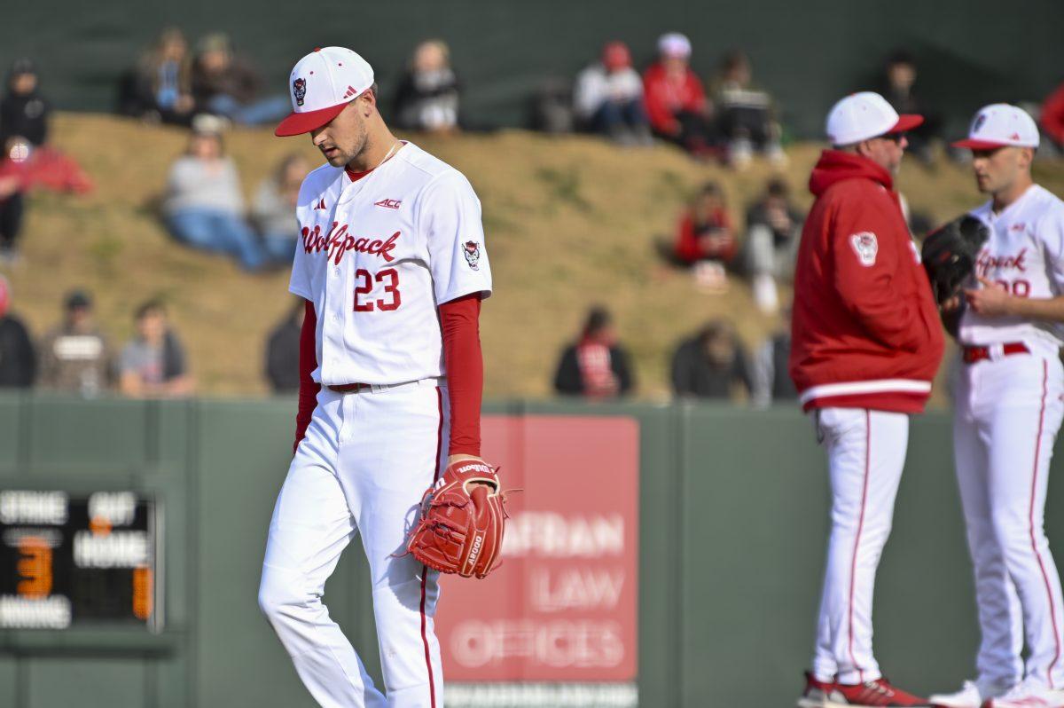 Graduate pitcher Matt Willadsen walks back to the dugout after getting swapped out during the baseball game against Liberty on Doak Field at Dail Park on Tuesday, Feb. 18, 2025. Willadsen pitched for 2.1 innings and allowed five hits and five earned runs. NC State lost to Liberty 8-9.