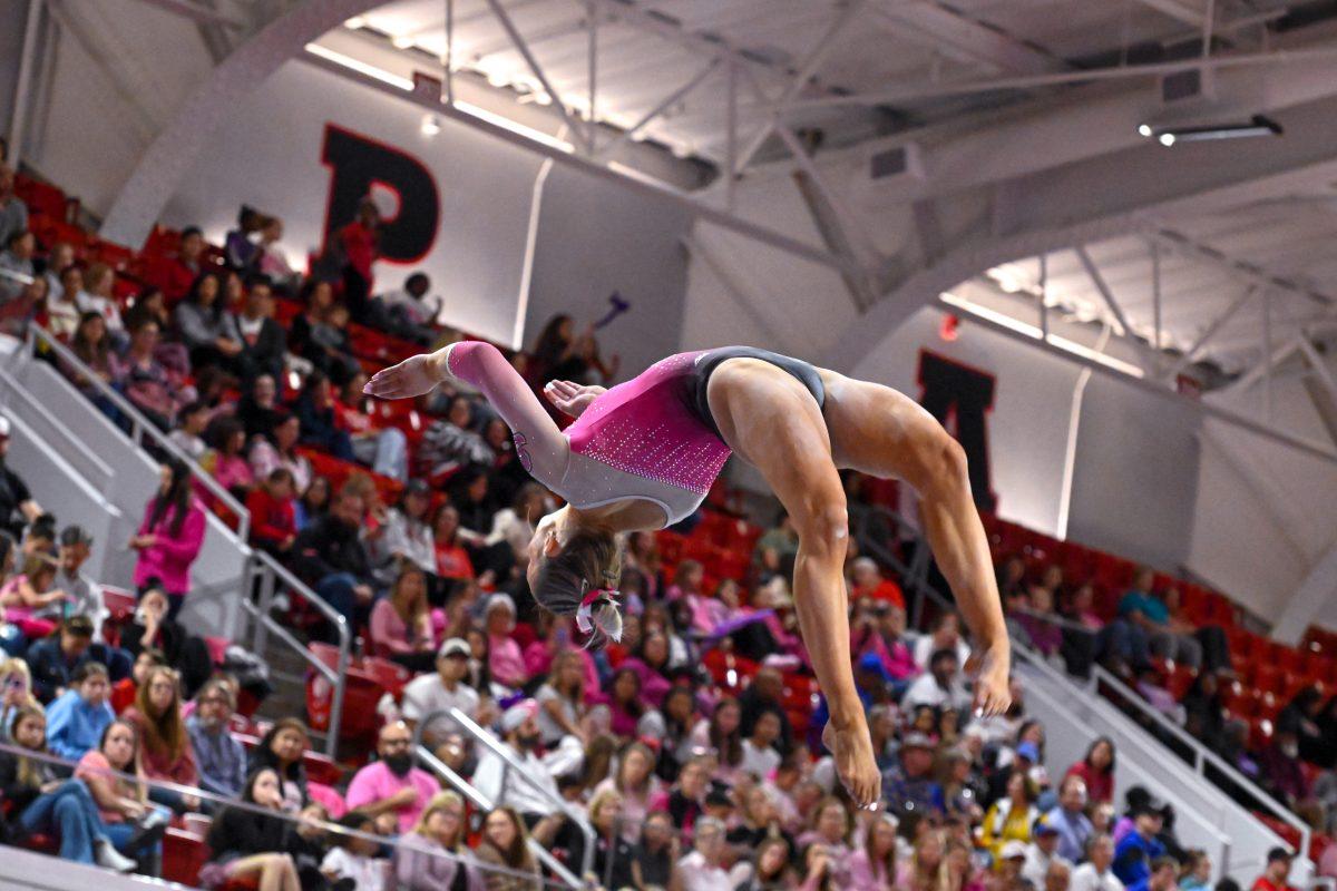 Senior Peyton Childs preforms her set on the balance beam during the meet against Pittsburgh at Reynolds Coliseum on Saturday, Feb. 8, 2025. Childs scored a 9.800 on the balance beam. NC State beat Pittsburgh 196.475-193.600.