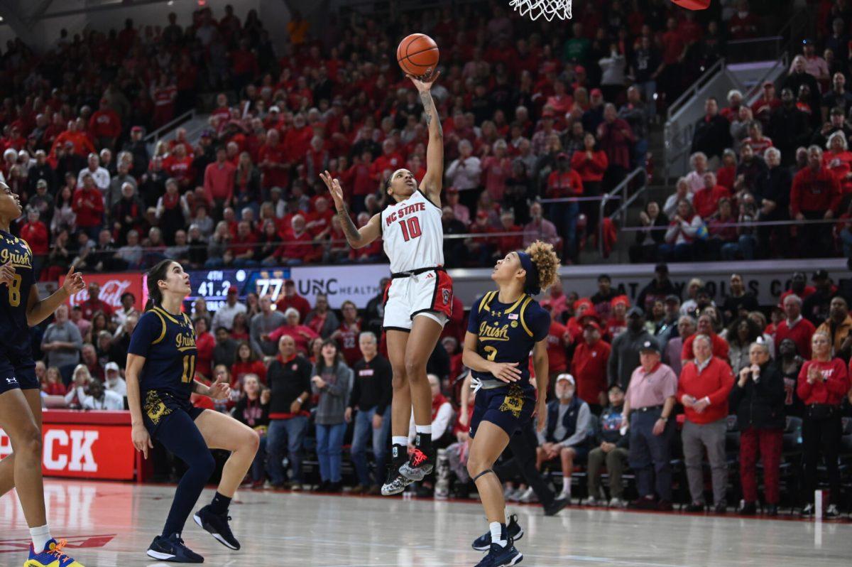 Senior guard Aziaha James goes up for a lay up during the game against the Notre Dame Fighting Irish in Reynolds Coliseum on Sunday, Feb. 23, 2025. James scored 20 points and recorded five rebounds and two assists. The Wolfpack beat the number one ranked Fighting Irish 104-95 in double overtime.