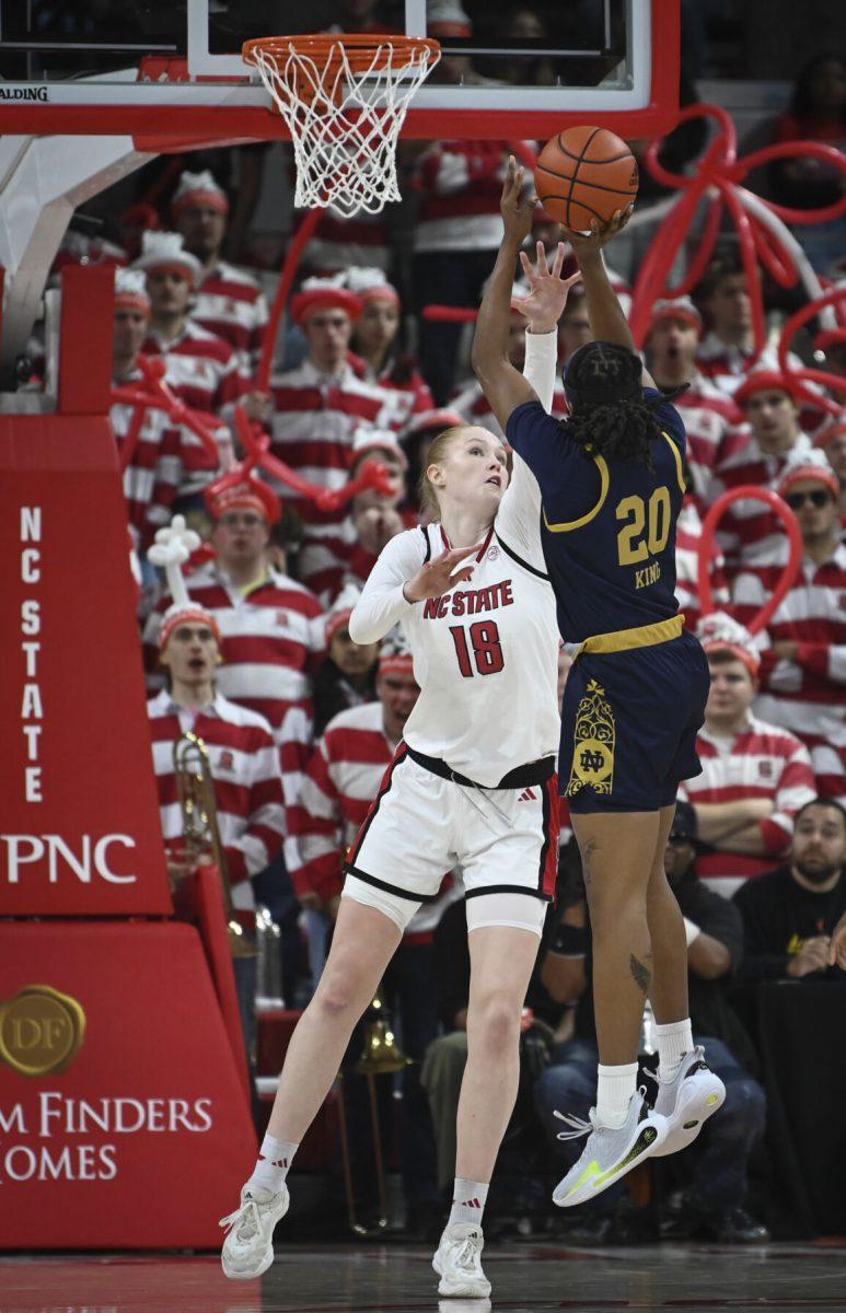 Freshman forward Tilda Trygger reaches to block an opponent during NC State's home game against Notre Dame in Reynolds Coliseum on Sunday, Feb. 23. Trygger scored 19 points and recorded nine rebounds, two blocks and one assist. The Wolfpack beat the top ranked Fighting Irish 104-95.