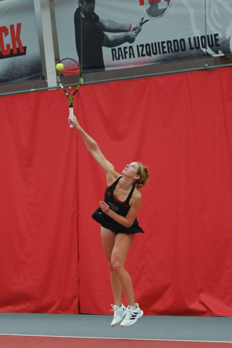Sophomore Maddy Zampardo serves during the match against Michigan at J. W. Isenhour Tennis Center on Friday, Feb. 14, 2025. Zampardo won her singles match 2-0. NC State beat Michigan 5-2.