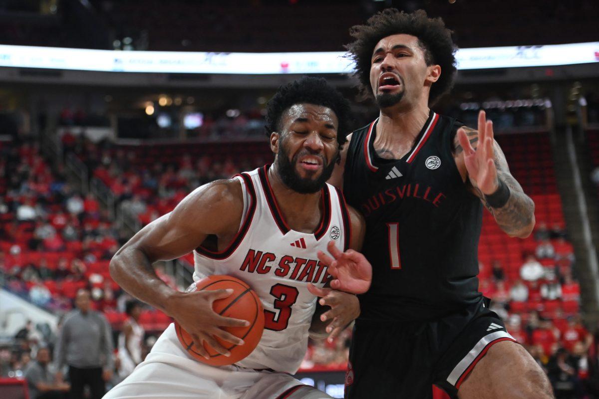 Senior guard/forward Dontrez Styles defends the ball during the match against Louisville in the Lenovo Center on Wednesday, Feb. 12, 2025. Styles had three rebounds and scored five points. The Wolfpack lost to the Cardinals 91-66.