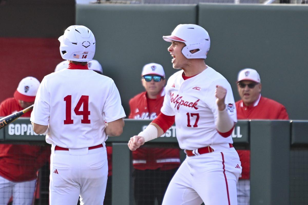 Sophomore infielder Matt Ossenfort yells after scoring a run during the baseball game against Liberty on Doak Field at Dail Park on Tuesday, Feb. 18, 2025. Ossenfort scored one run. NC State lost to Liberty 8-9.