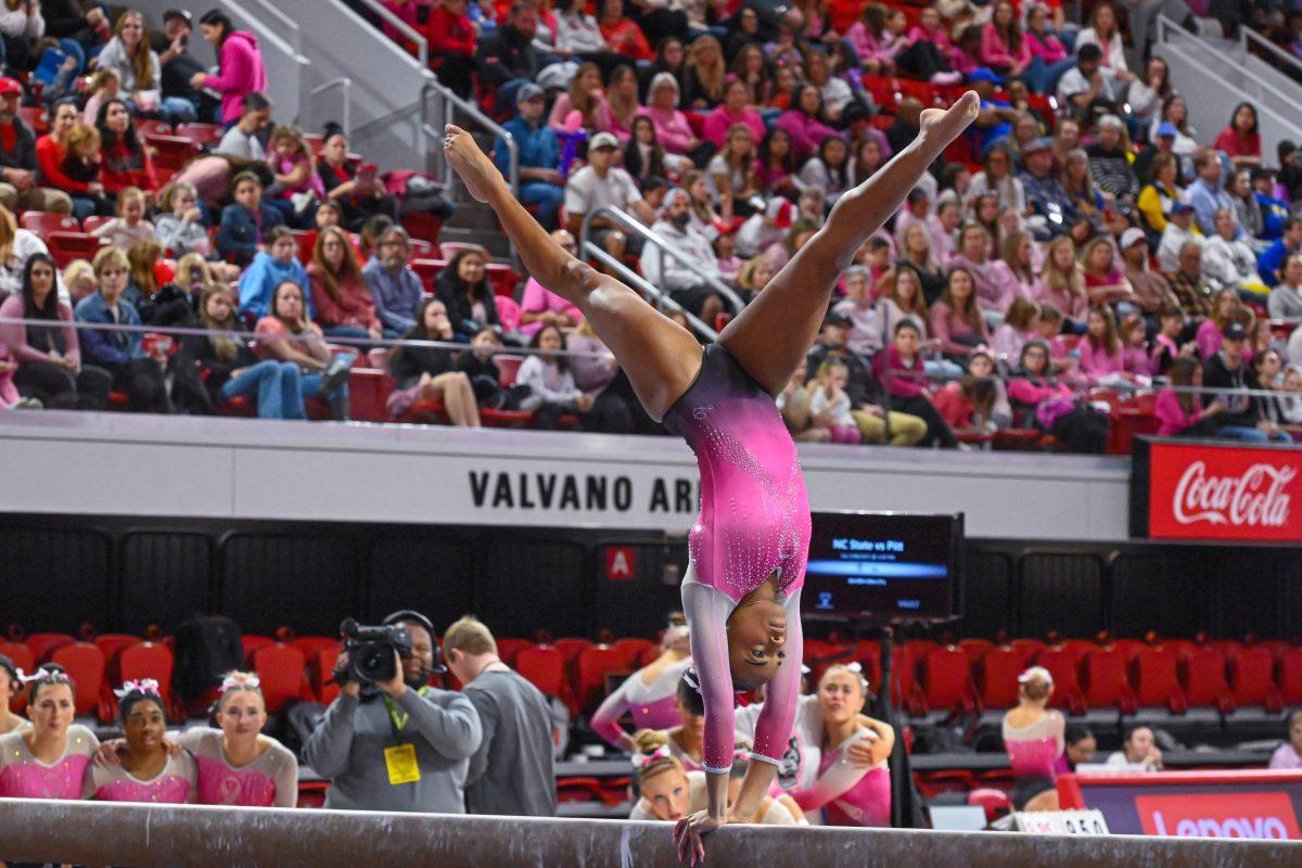 Sophomore Ashley Knight preforms a flip on the balance beam during the meet against Pittsburgh at Reynolds Coliseum on Saturday, Feb. 8, 2025. Knight recorded a 9.700 on the balance beam. NC State beat Pittsburgh 196.475-193.600.