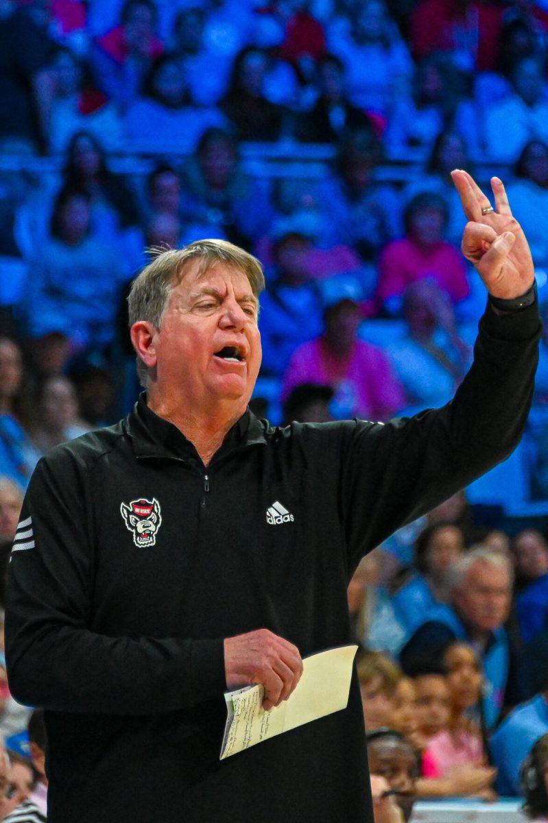 NC State women's basketball head coach Wes Moore holds up a three during the game against UNC on&#160;Sunday, Feb. 16, 2025 in Carmichael Arena. UNC defeated NC State 66-65
&#160;