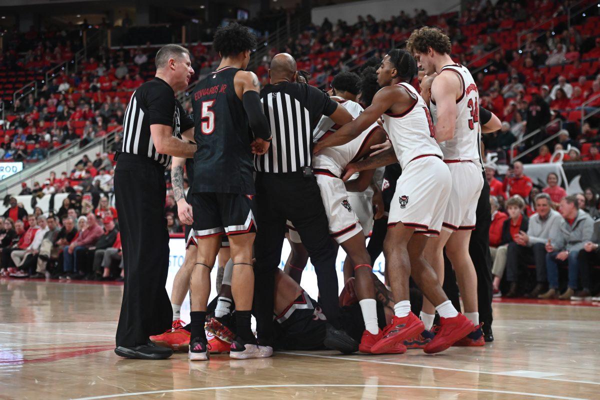 Referees break up a mid-game altercation during the match against Louisville in the Lenovo Center on Wednesday, Feb. 12, 2025. NC State had 28 rebounds combined. The Wolfpack lost to the Cardinals 91-66.
