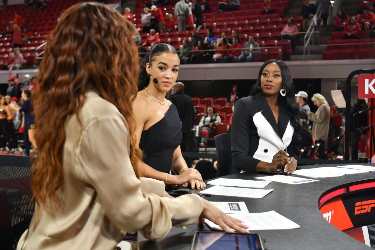 ESPN College Gameday hosts Elle Duncan, Andraya Carter and Chiney Ogwumike sit at the desk in Reynolds Coliseum before the matchup between the thirteenth ranked NC State Wolfpack and the number one ranked Notre Dame Fighting Irish in Reynolds Coliseum on Sunday, Feb. 23, 2025. Duncan, Carter and Ogwumike all picked Notre Dame to win, but the Wolfpack beat the Fighting Irish 104-95 in double overtime.