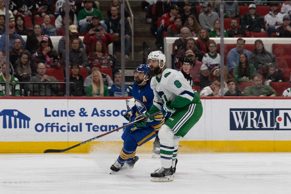 Defensemen Brent Burns looks up, searching for the puck, during the Whalers Night game versus the Buffalo Sabres&#160;at the Lenovo Center on Thursday, Feb. 27, 2025. The Hurricanes beat the Sabres&#160;5-2.