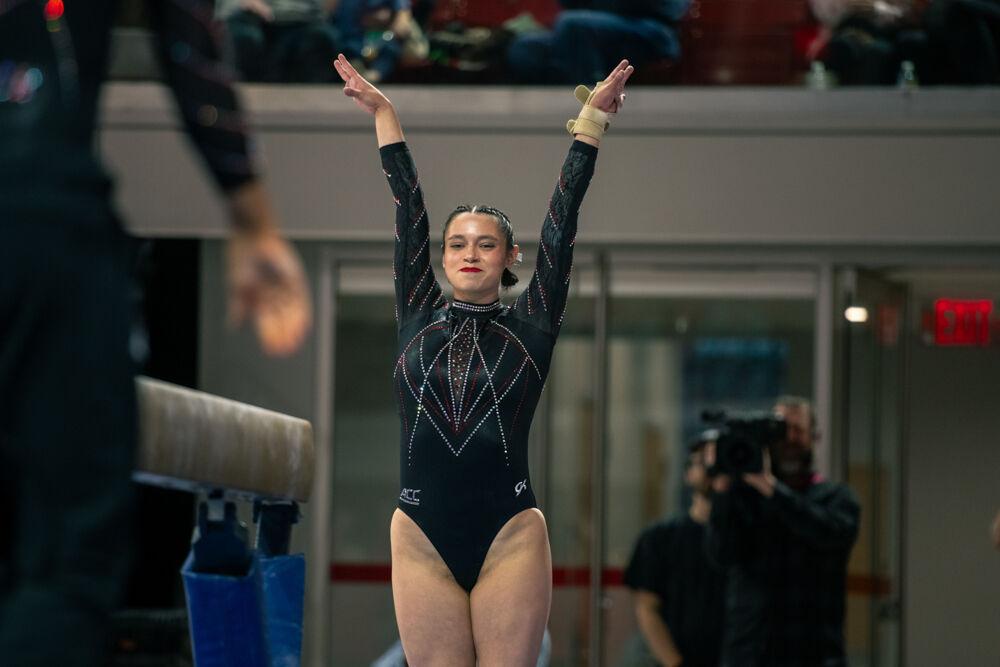 Graduate Chloe Negrete sticks the landing during the meet against California in Reynolds Coliseum on Sunday, Feb. 2, 2025. Negrete scored 9.900 points on the balance beam. The Wolfpack lost to the Bears 197.175-196.550