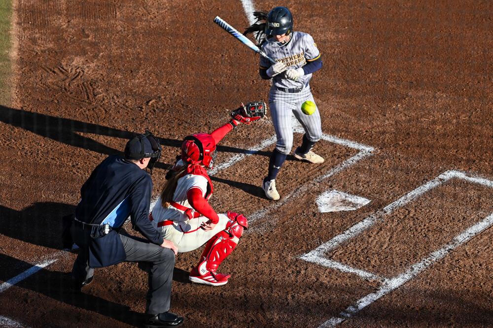 Junior catcher Hannah Church reaches for a pitch during the game against Northern Colorado in the Marucci Classic at Dail Softball Stadium on Friday, Feb. 21, 2025. Church had two hits out of her three at bats. NC State won against Northern Colorado 11-1.