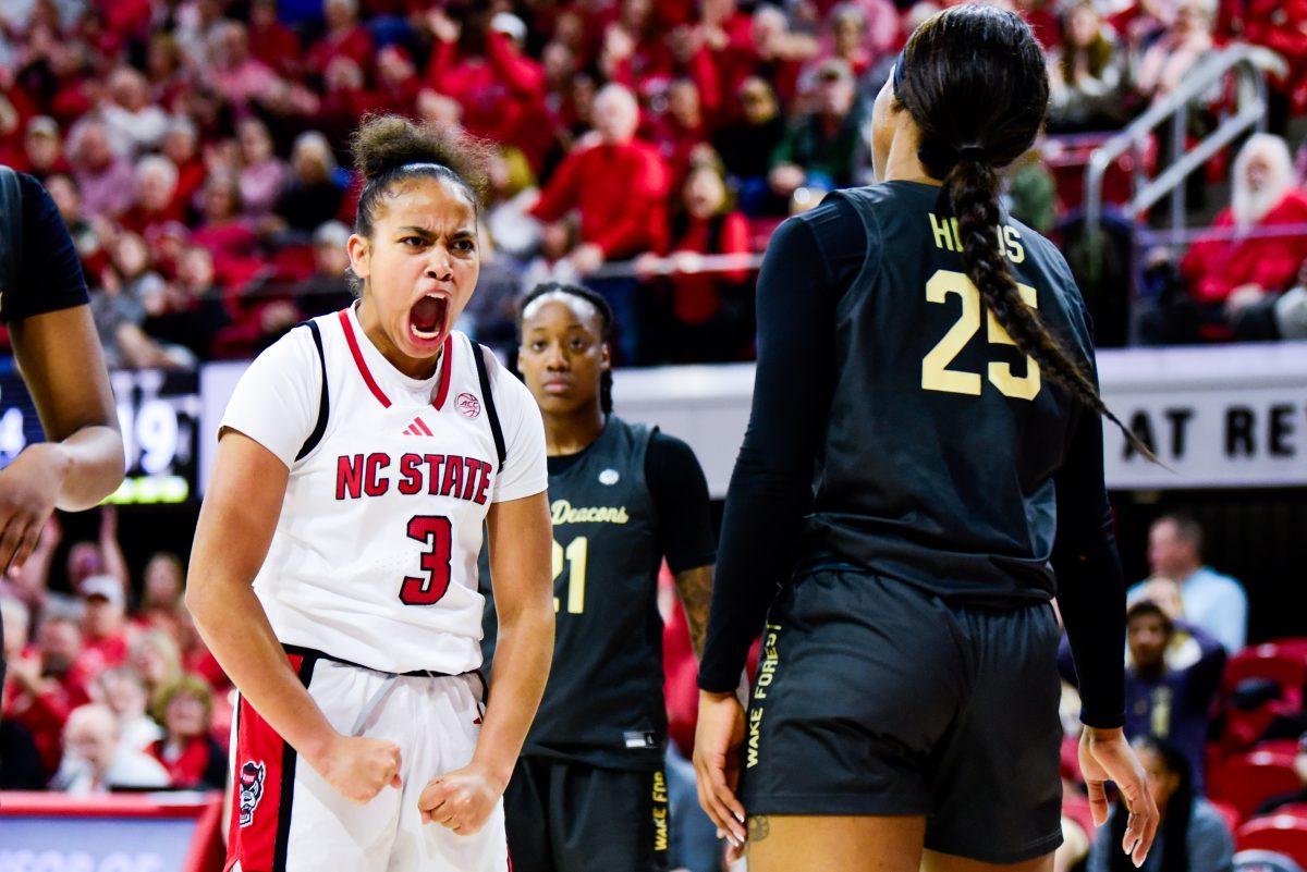 Freshman guard Zamareya Jones flexes after an and-one during the game against Wake Forest in Reynolds Coliseum on Thursday, Feb. 27, 2025. Jones scored eight points. The Wolfpack beat the Demon Deacons 78-57 on senior night.