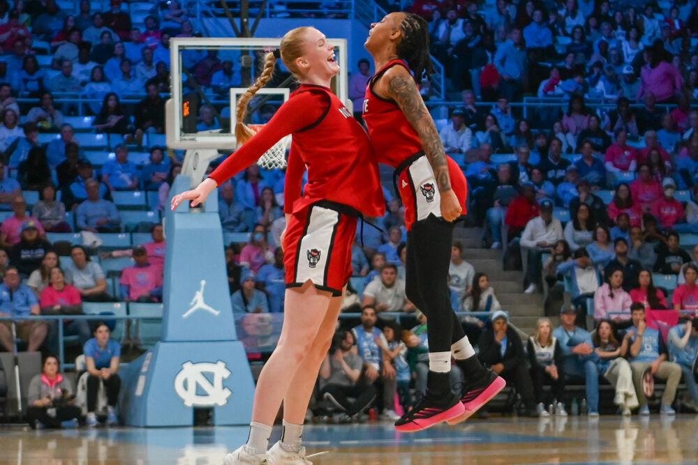 Freshman forward Tilda Trygger and senior guard Aziaha James chest bump after the team scores a point during the game against UNC-Chapel Hill in Carmicheal Arena on Sunday, Feb. 16, 2025. NC State lost to Chapel Hill 66-65.