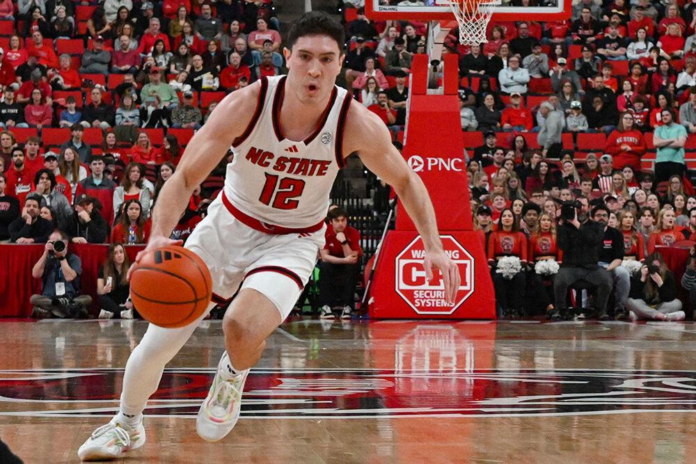 Graduate guard Michael O'Connell drives toward the rim during the game against Wake Forest at the Lenovo Center on Saturday, Feb. 22, 2025. O'Connell recorded nine points and 13 assists. NC State defeated Wake Forest 85-73.
